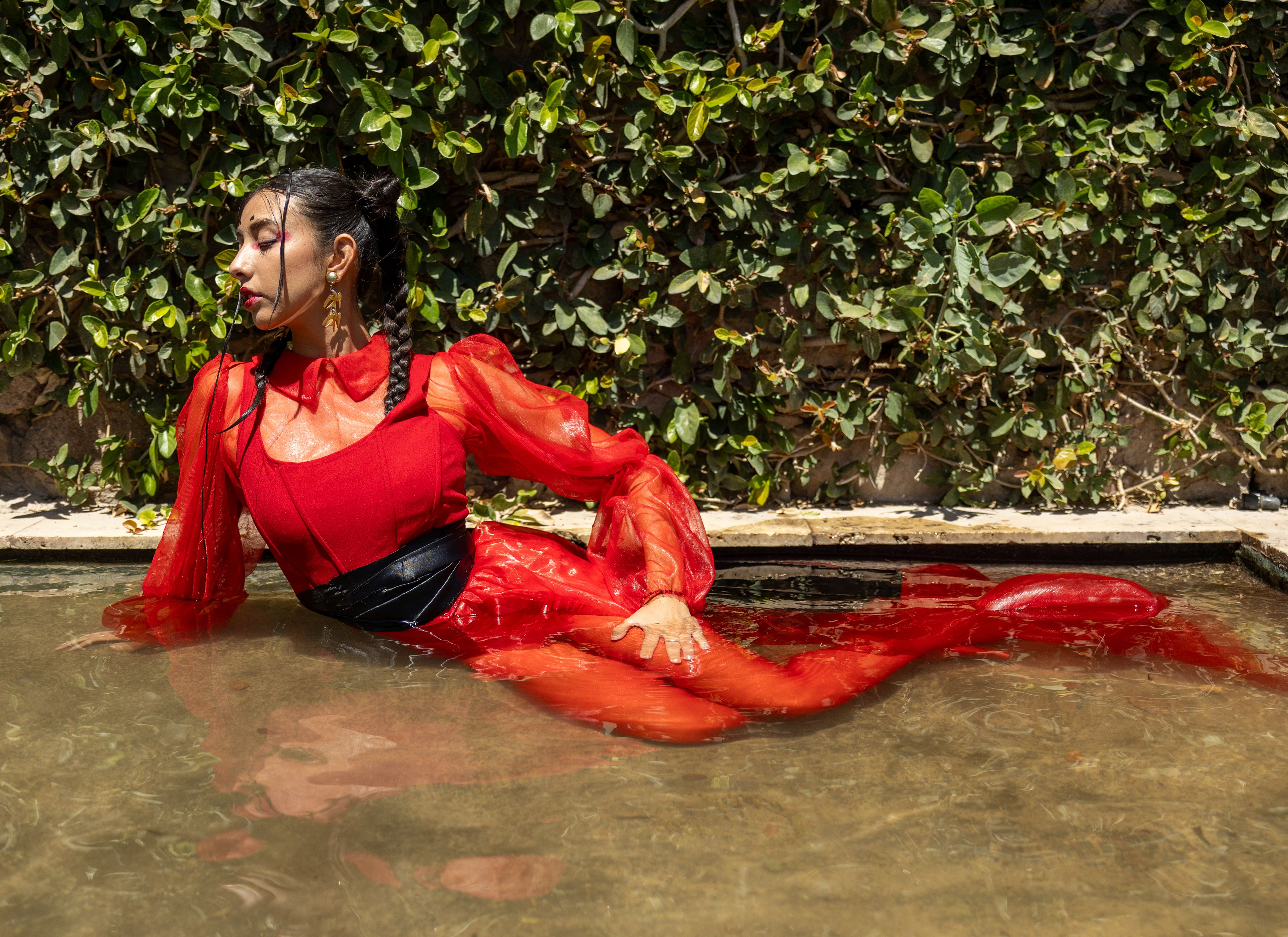 Elegant Woman in Red Dress Relaxing in Water · Free Stock Photo
