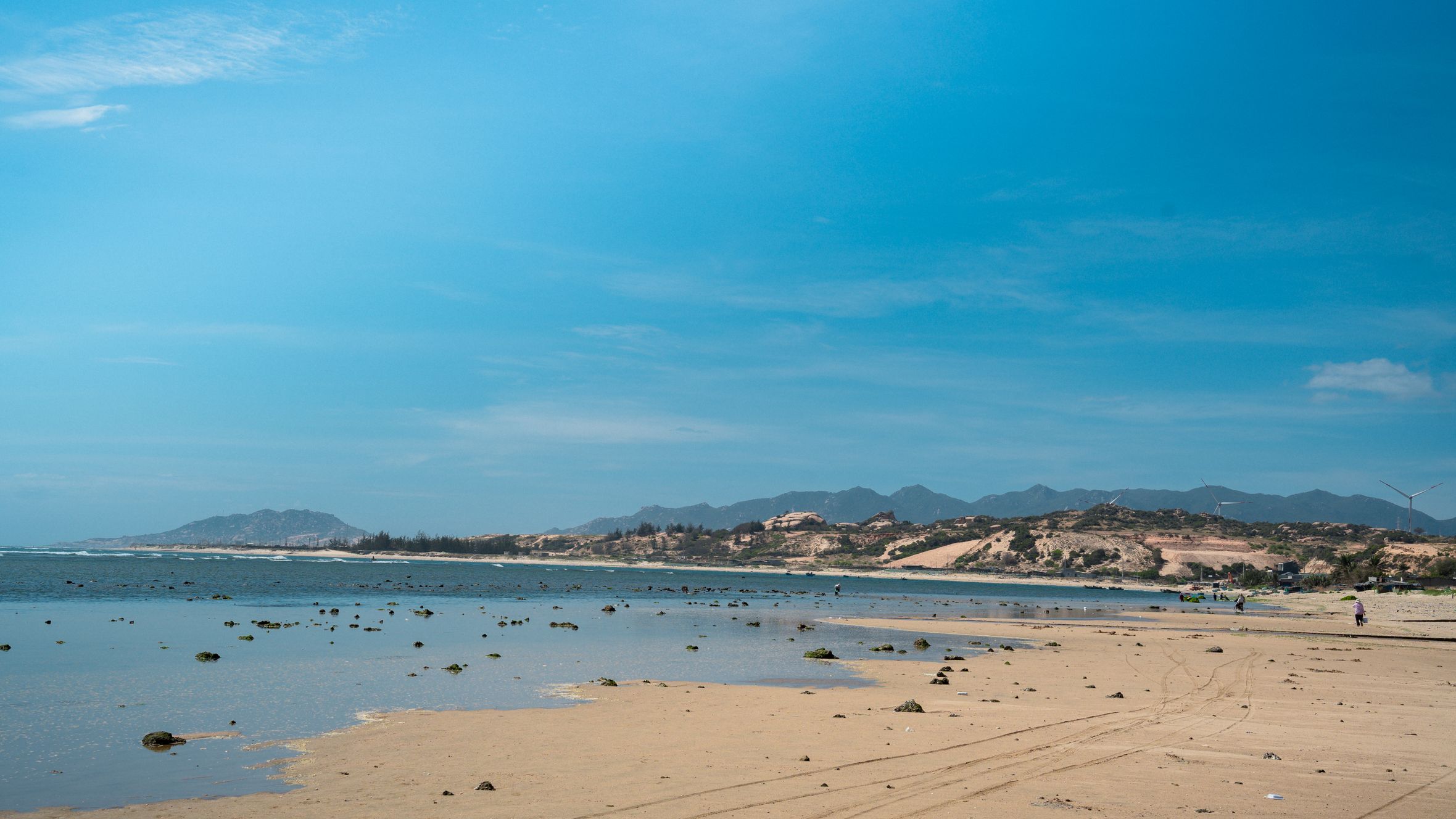 Stunning beach view under a clear blue sky in Central Vietnam, offering a tranquil coastal escape.