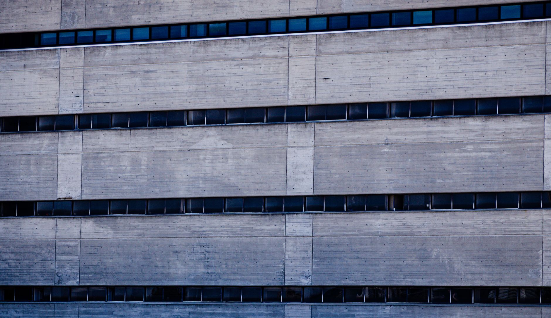 Detailed view of a concrete building facade showcasing brutalist architecture style.. detailed, view, concrete