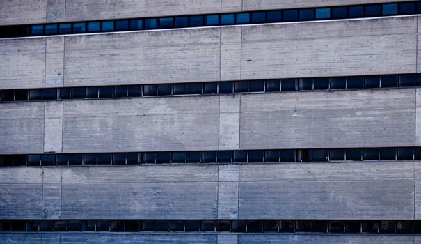 Detailed view of a concrete building facade showcasing brutalist architecture style.. detailed, view, concrete