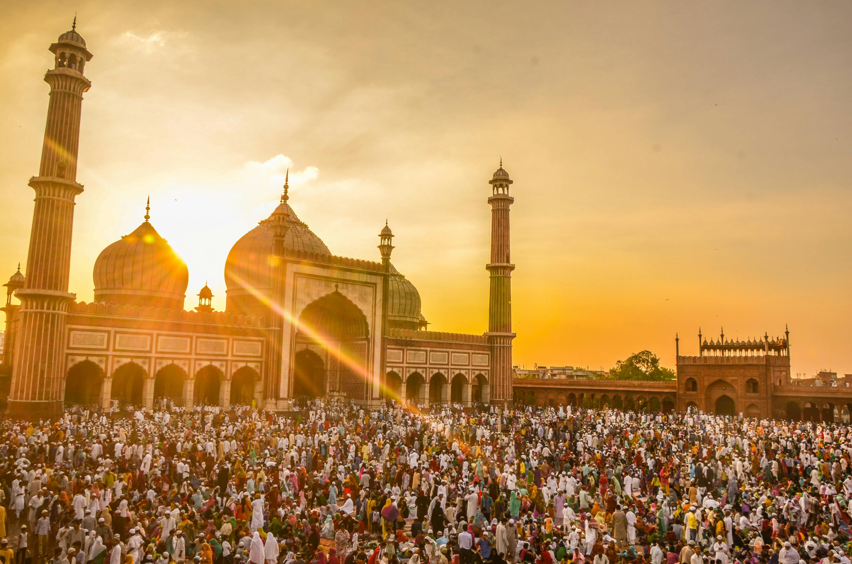 Photo Of People In Front Of Mosque During Golden Hour · Free Stock Photo