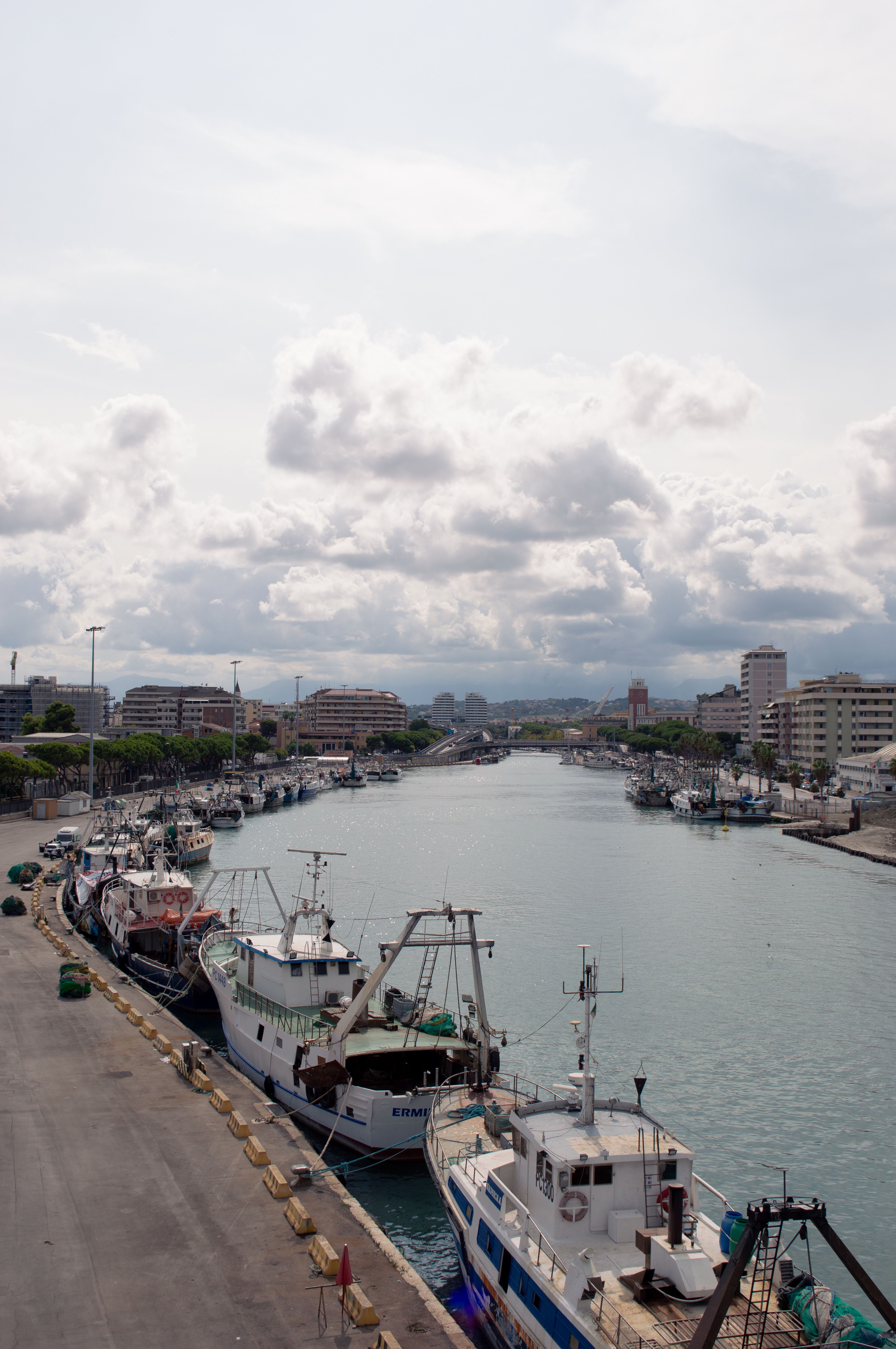 Fishing Boats Docked at a Coastal Harbor · Free Stock Photo