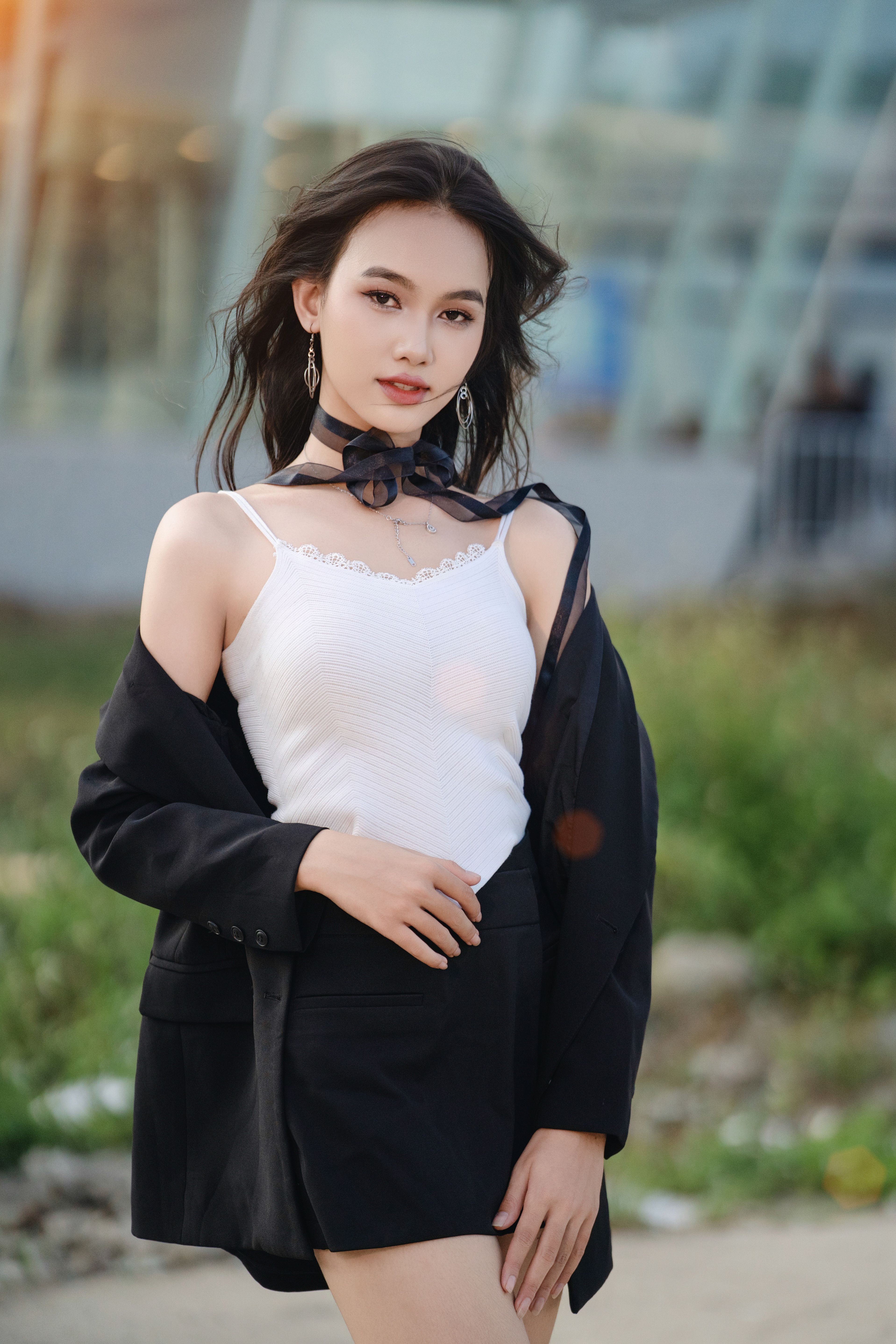 Stylish Young Woman Posing Outdoors in Fashionable Attire · Free Stock ...