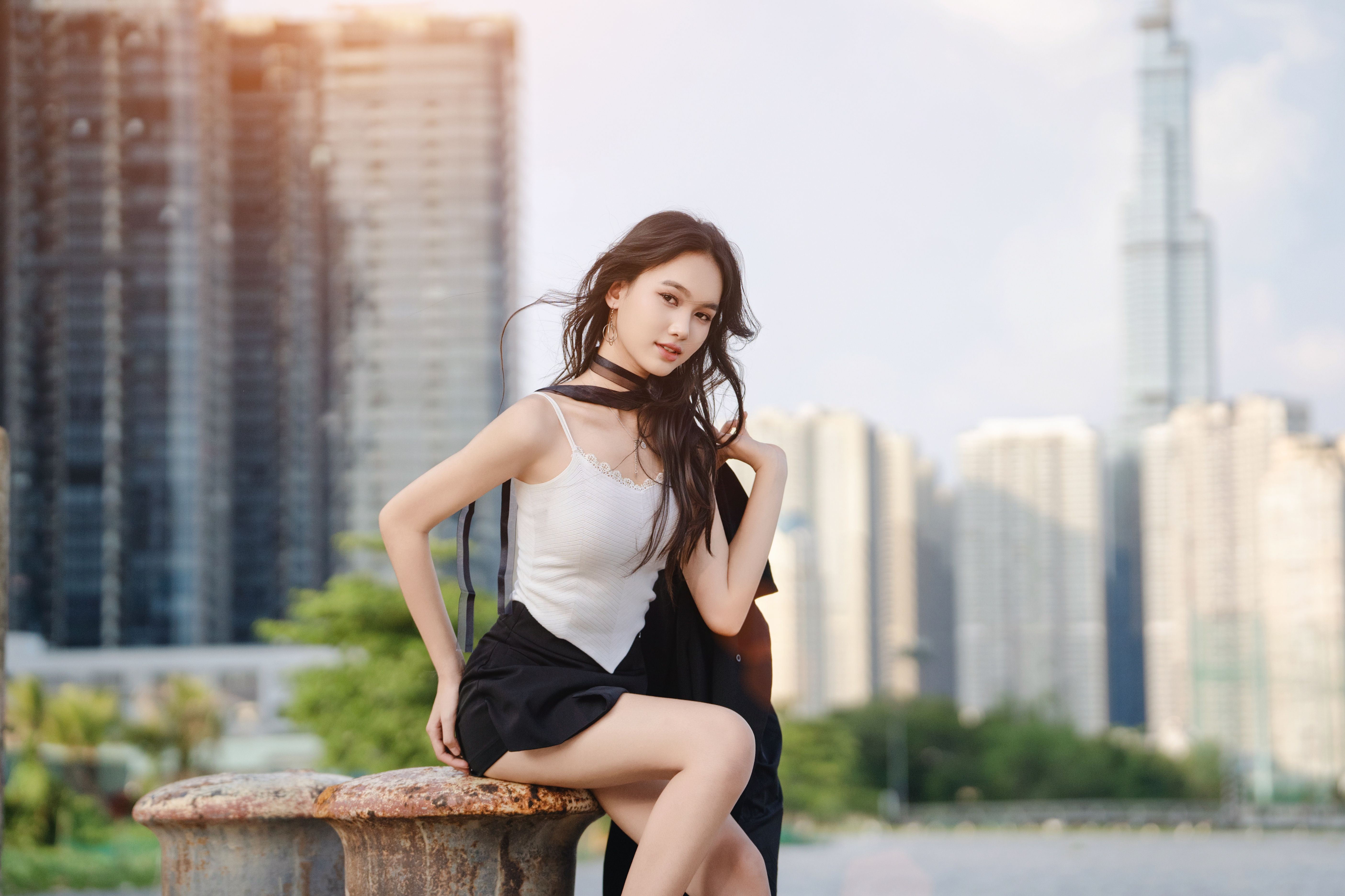 Urban Portrait of Woman with Modern Skyline · Free Stock Photo