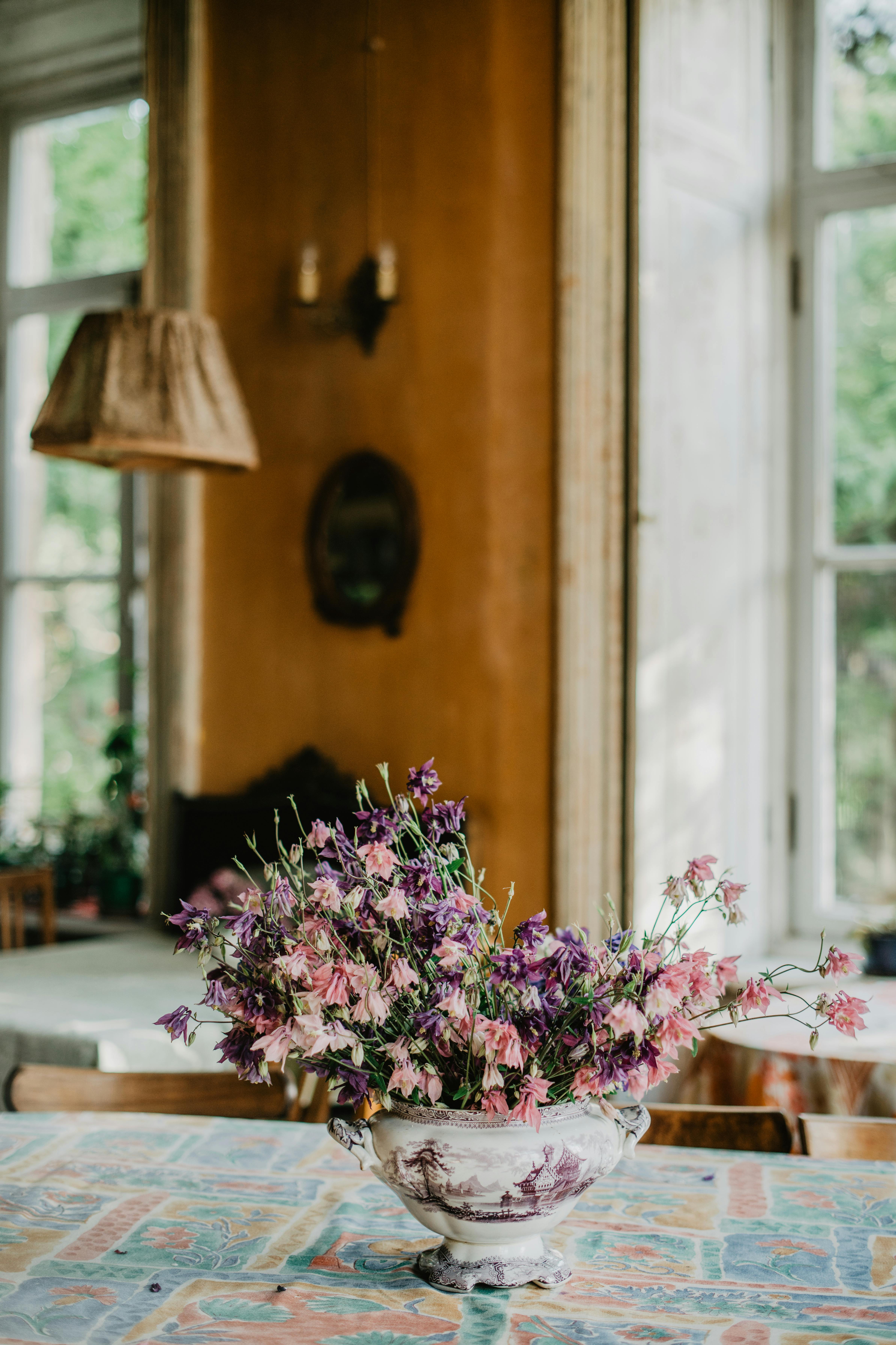 Inviting interior with vintage decor and a delicate flower arrangement in a cozy setting.