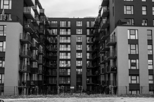 Black and white photo of a modern apartment block showcasing urban architecture.