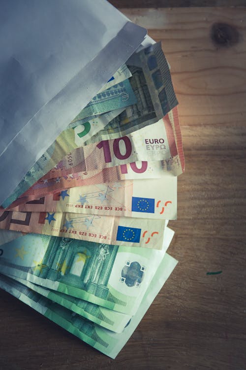 Free 50 Euro Bill on Brown Wooden Table Stock Photo