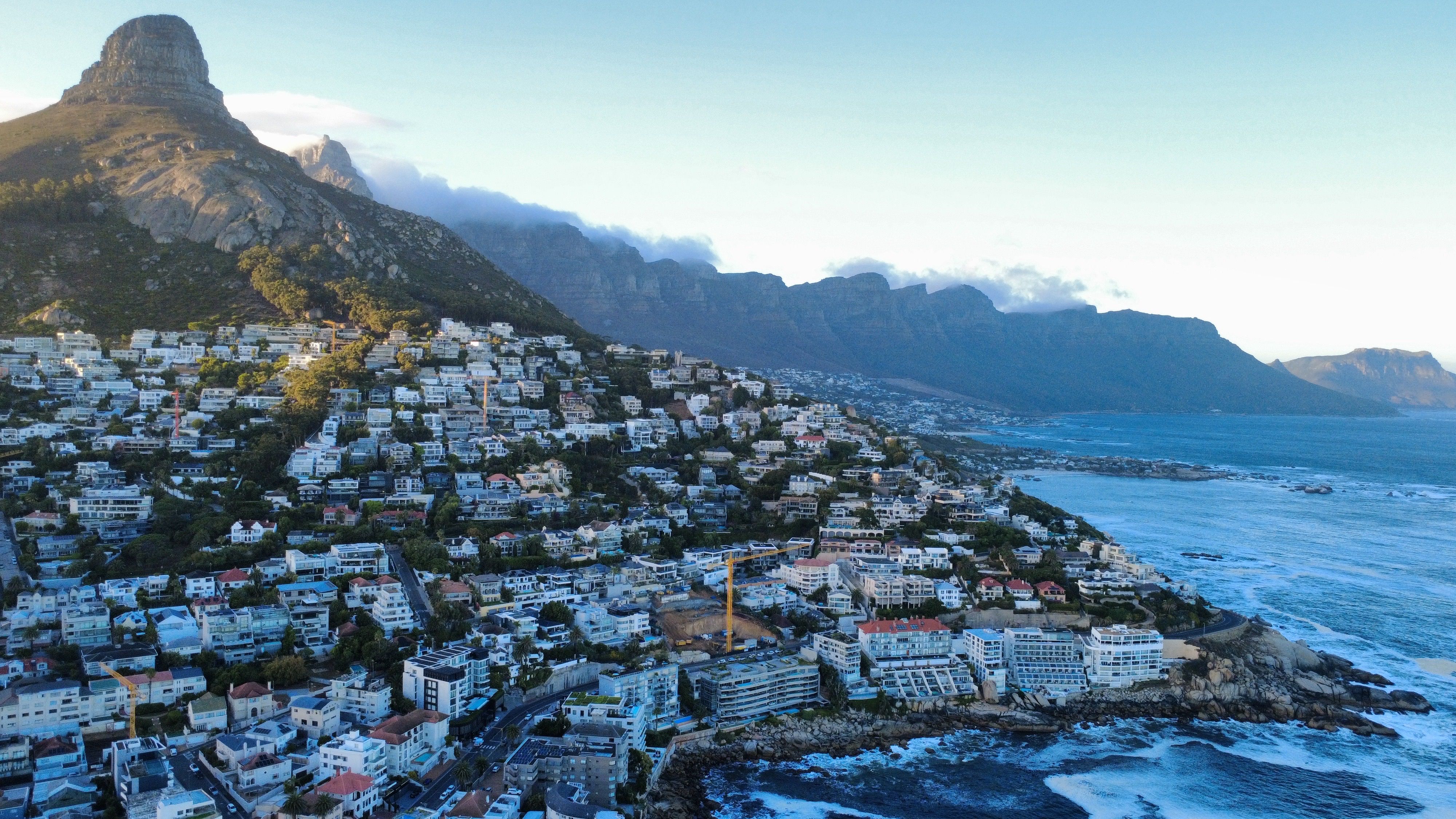Best Scenic Cape Point Helicopter Tour from Cape Town Review Review 2026 - Stunning aerial view of Cape Town's coastline with Lion's Head mountain, capturing the blend of urban and natural landscapes.