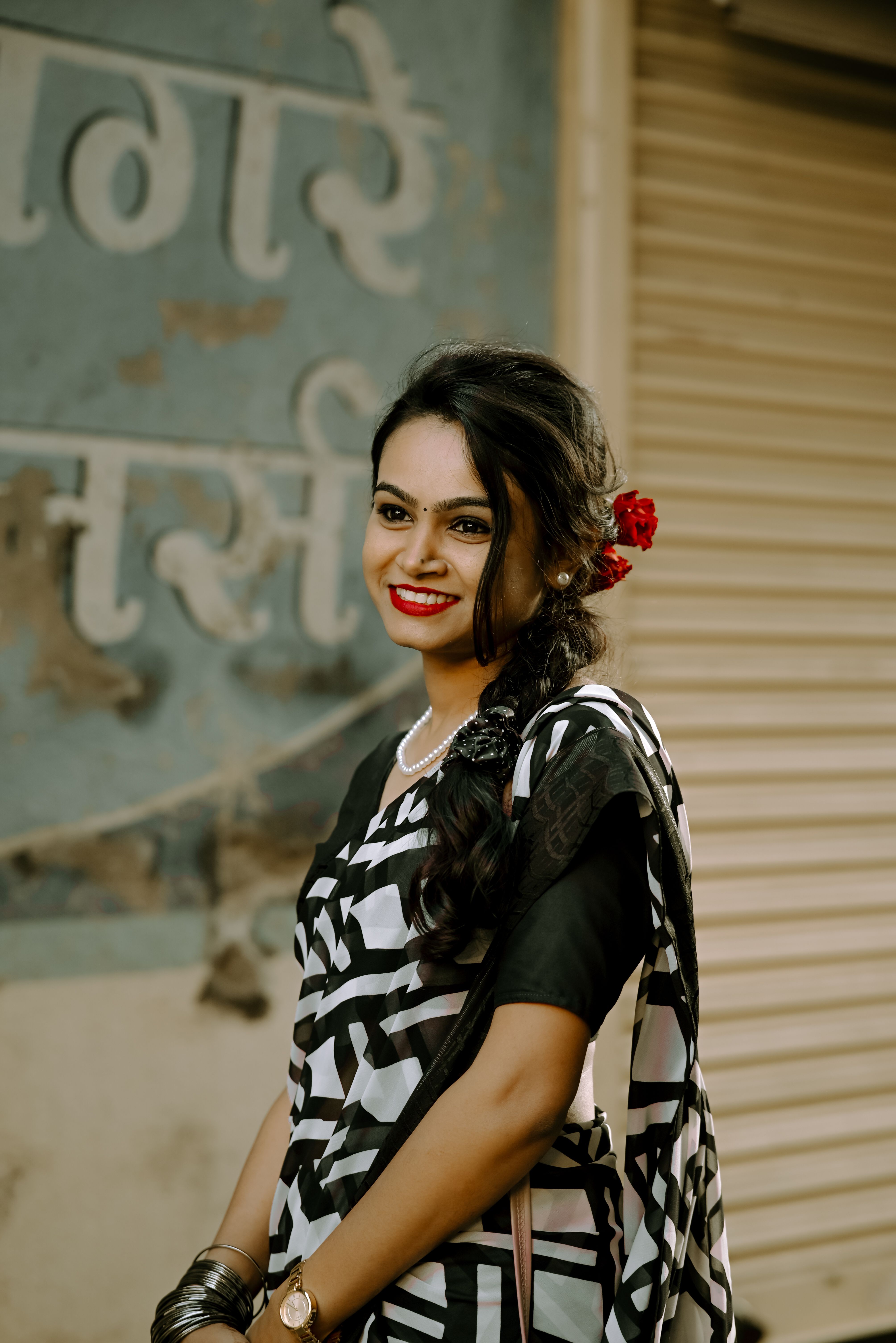 Elegant Woman in Traditional Black and White Saree · Free Stock Photo