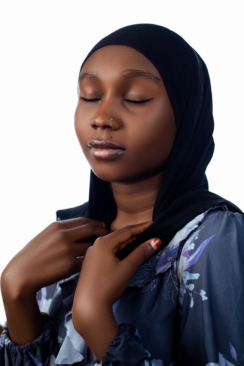 Free Portrait of a serene young woman with closed eyes wearing a hijab, exuding tranquility. Stock Photo