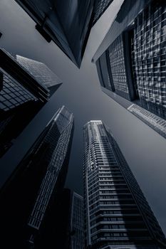 Dramatic perspective of Frankfurt skyscrapers reaching into the sky.