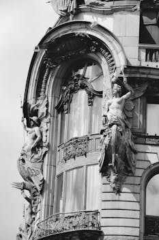 Black and white photo of ornate Art Nouveau details on a historic building in St. Petersburg, Russia.