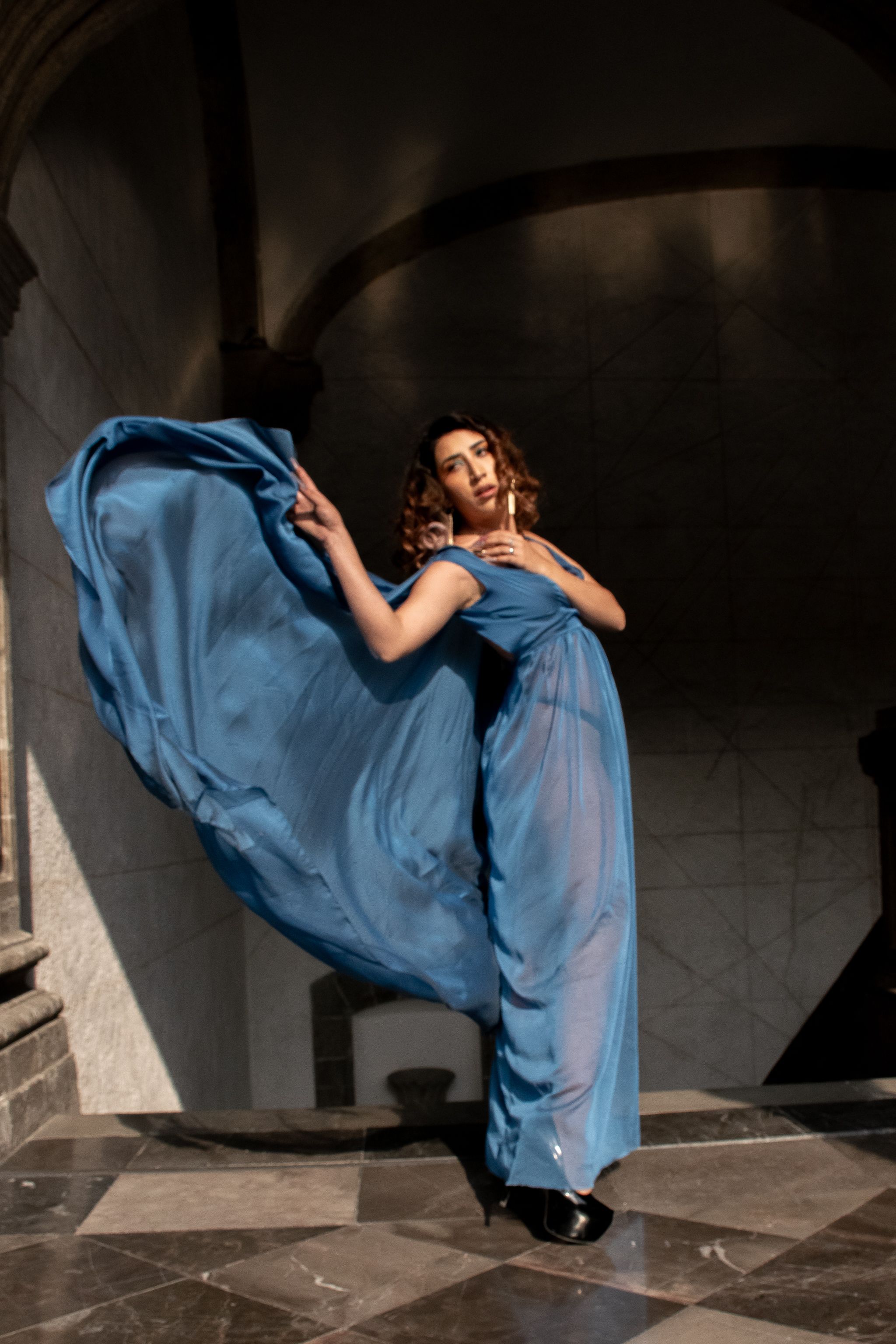 Elegant Woman in Blue Dress Posing Dramatically · Free Stock Photo