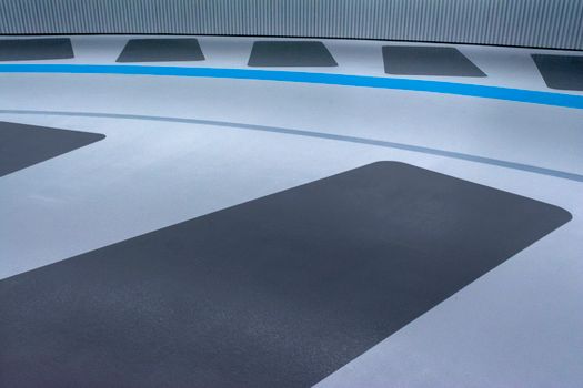Artistic modern design in a parking garage featuring geometric patterns and bold colors.