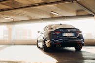 Sleek car parked in sunlit garage