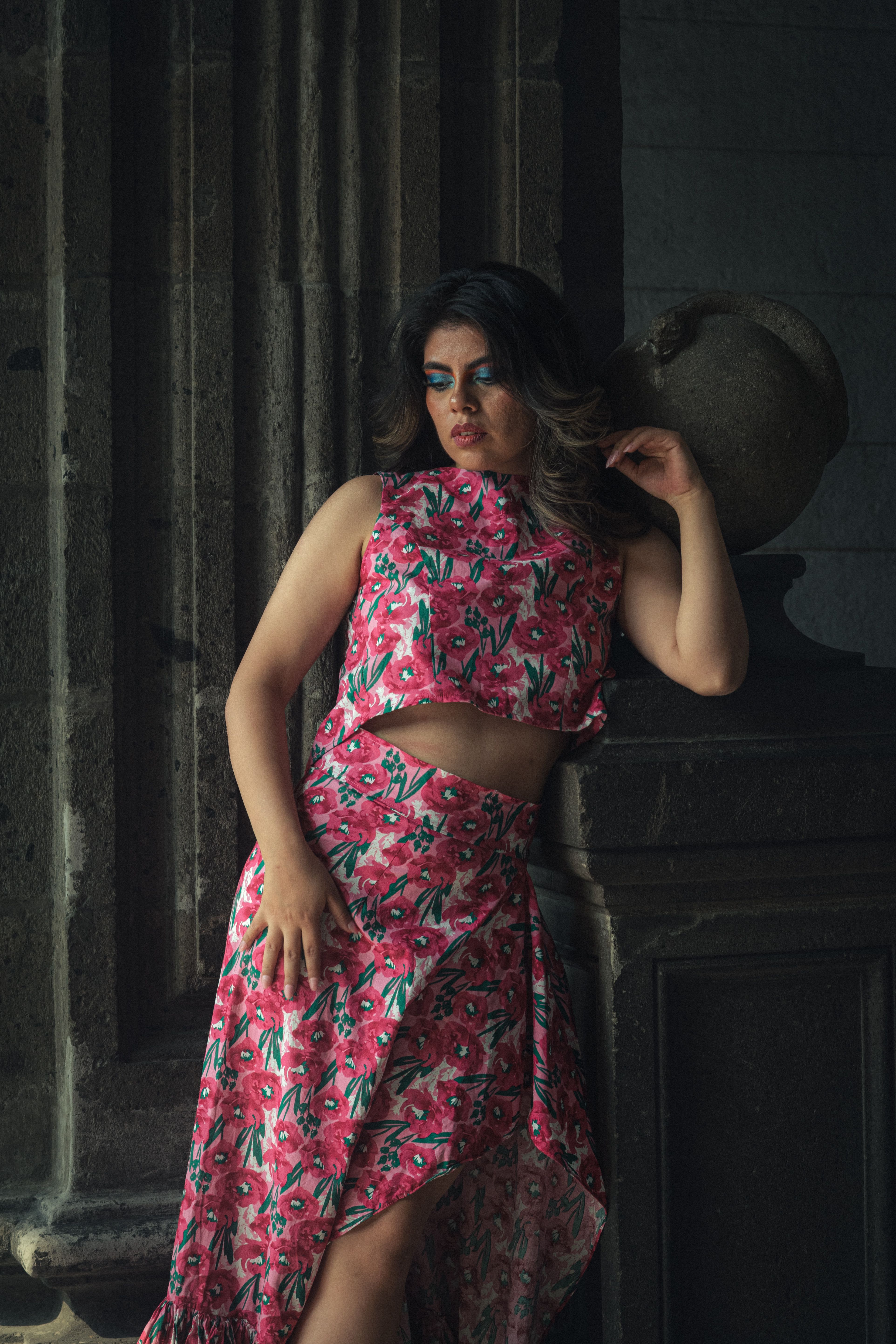 Woman in Floral Dress Posing Indoors · Free Stock Photo