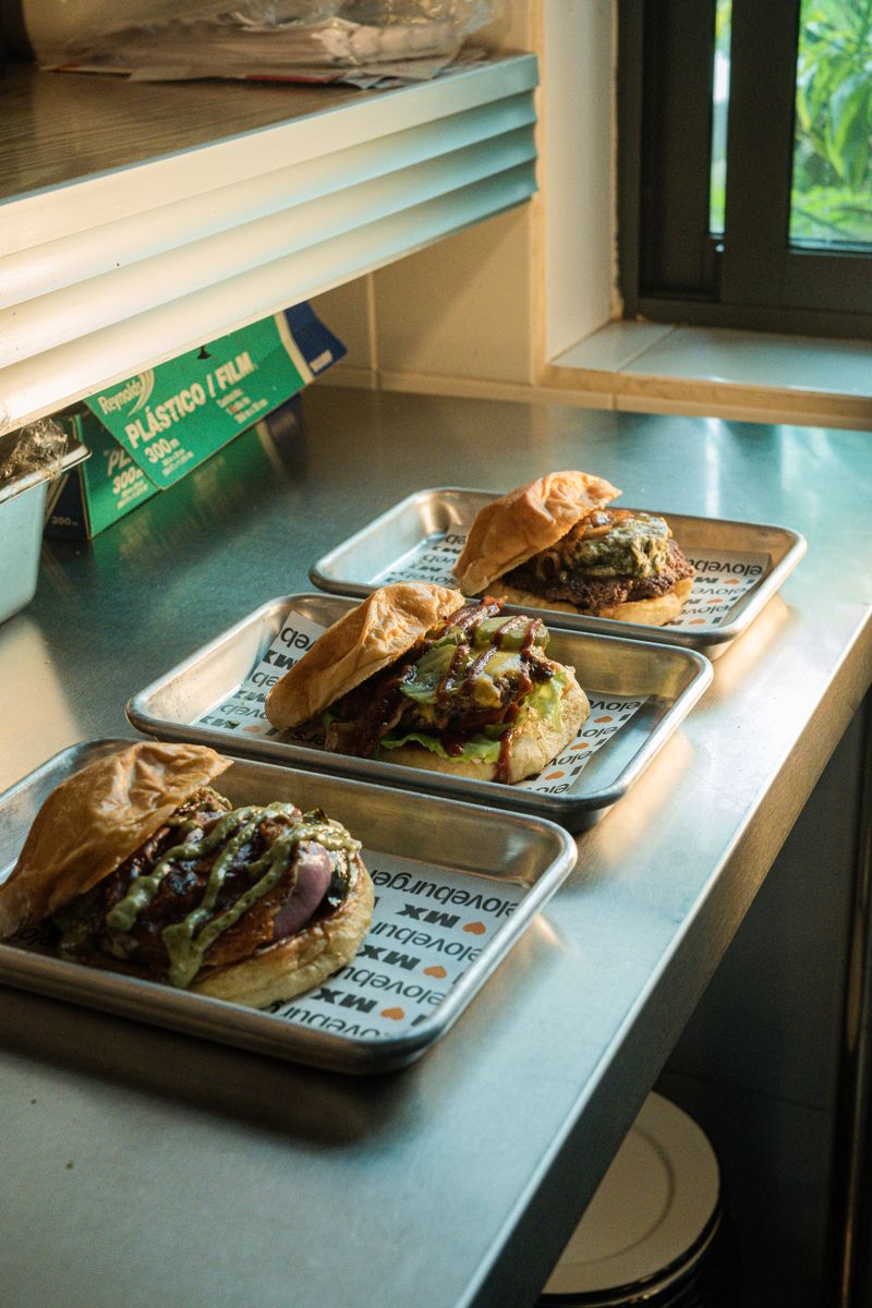 Tasty burgers on trays ready in the restaurant