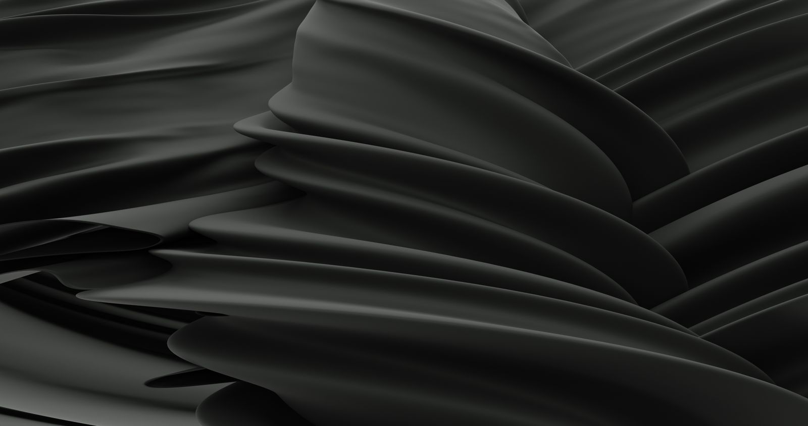Undulating folds of black satin fabric — photo by Mahmoud Ramadan on Pexels