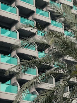 Contemporary urban living with palm trees and a unique architectural design in Dubai.