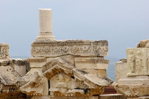 Free Stunning detail of ancient Roman architectural ruins with decorative stone carvings and columns. Stock Photo