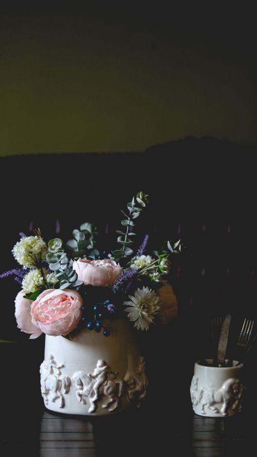 Free Aesthetic floral arrangement in an ornate vase, creating a vintage and artistic ambiance. Stock Photo