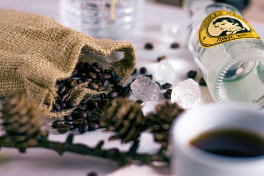 Selective Focus Photography of Bag of Beans Beside Clear Glass Bottle