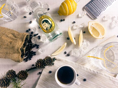 Beans and Sliced Lemon Near Glass Bottle