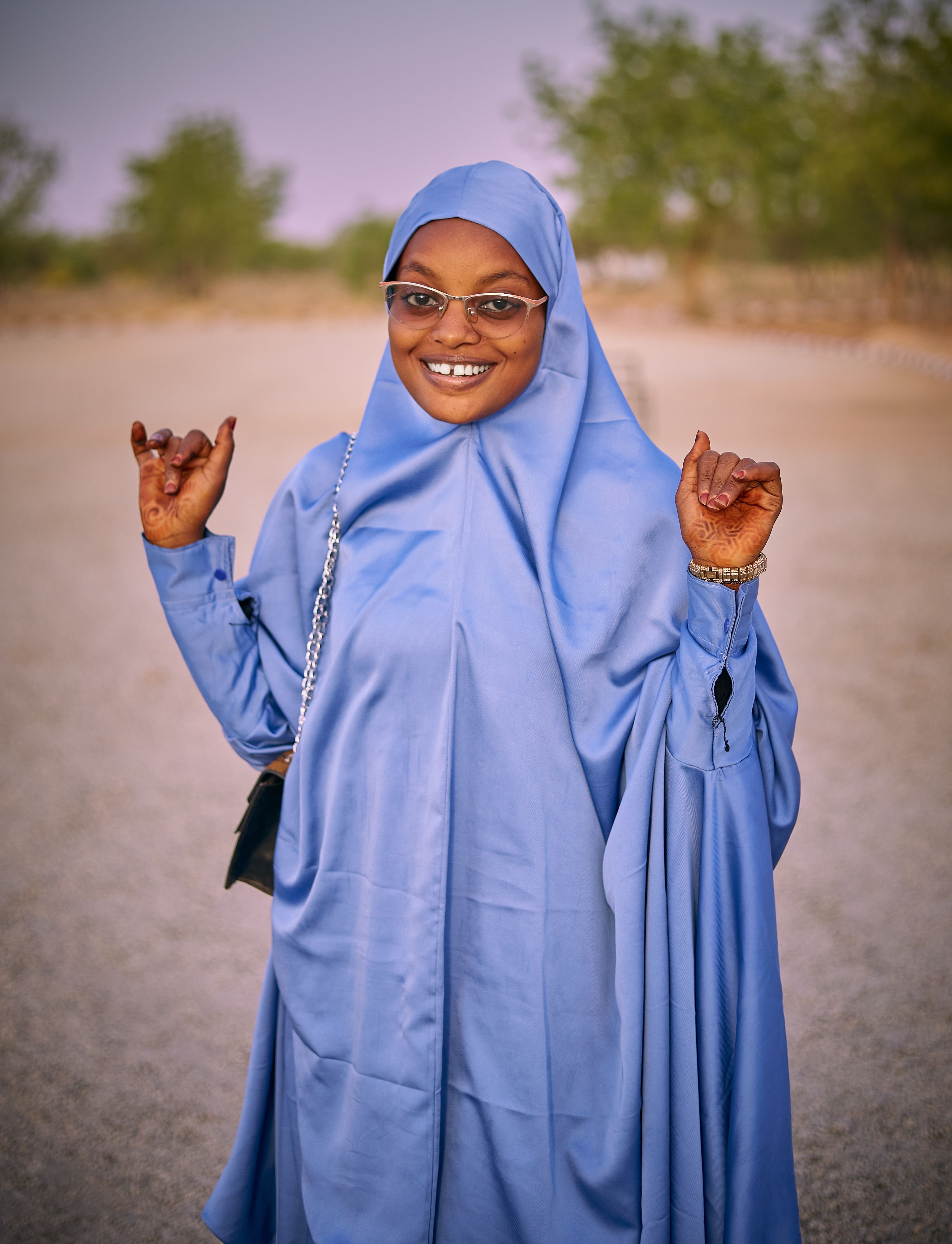 Smiling Woman in Blue Hijab Outdoors · Free Stock Photo