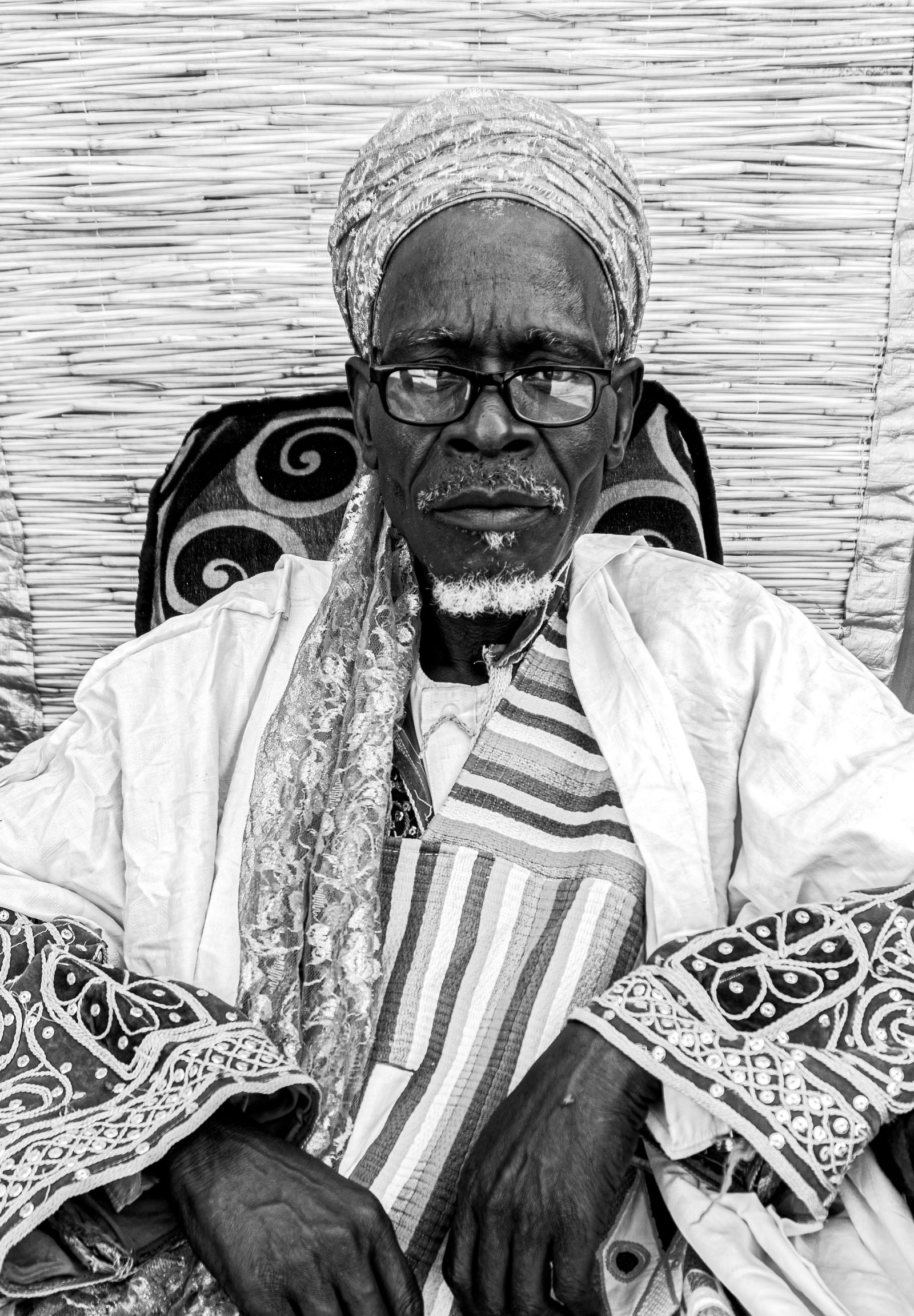 Portrait of an elderly Nigerian man in traditional attire