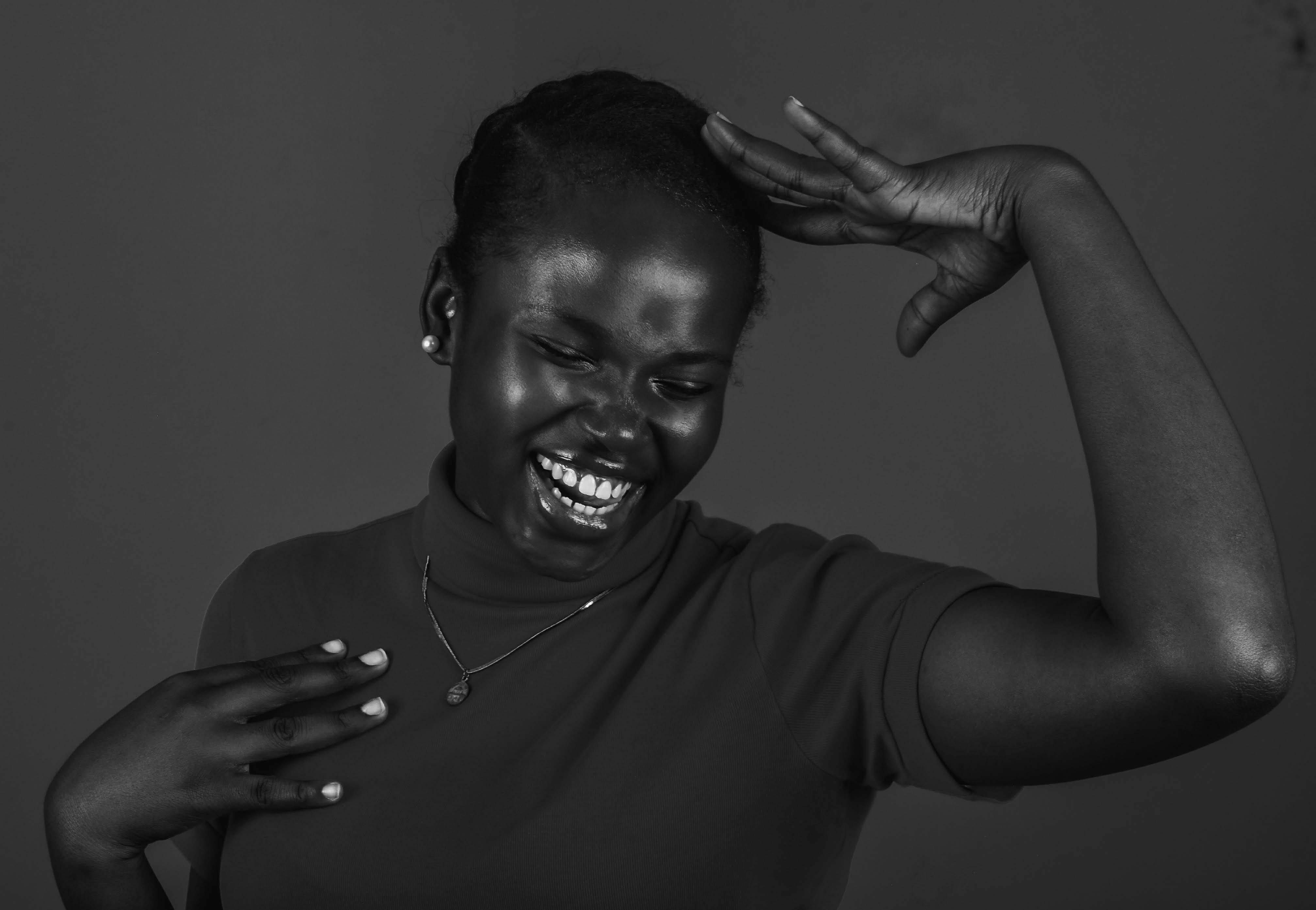 Joyful Woman Laughing in Black and White Portrait · Free Stock Photo