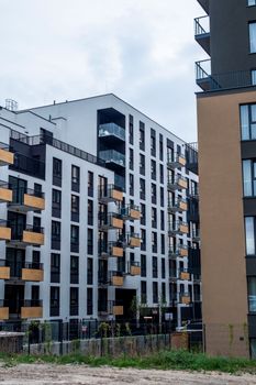 Contemporary apartment blocks showcasing modern architectural design in urban setting.