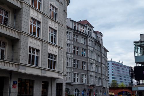 Free Street view of historic urban architecture against a cloudy sky. Stock Photo