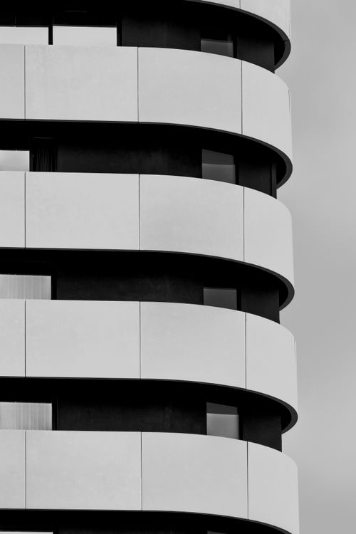 Free Black and white abstract design of modern architecture highlighting symmetry and lines. Stock Photo