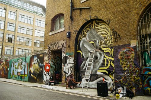 Free Vibrant street art on Brick Lane, London captures urban creativity and culture. Stock Photo