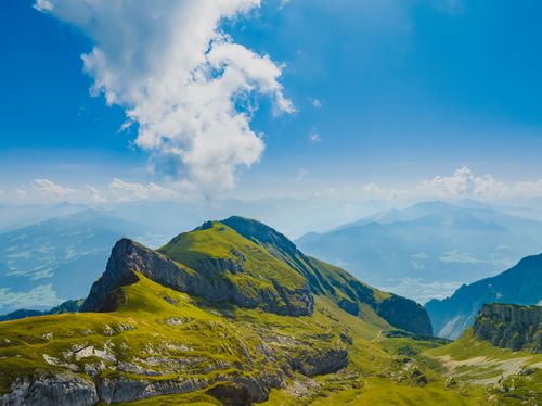 Free Breathtaking view of mountain landscape under a vibrant blue sky with clouds. Stock Photo