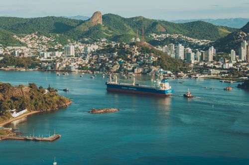 Free A stunning aerial view of Salvador harbor featuring a cargo ship and surrounding cityscape. Stock Photo