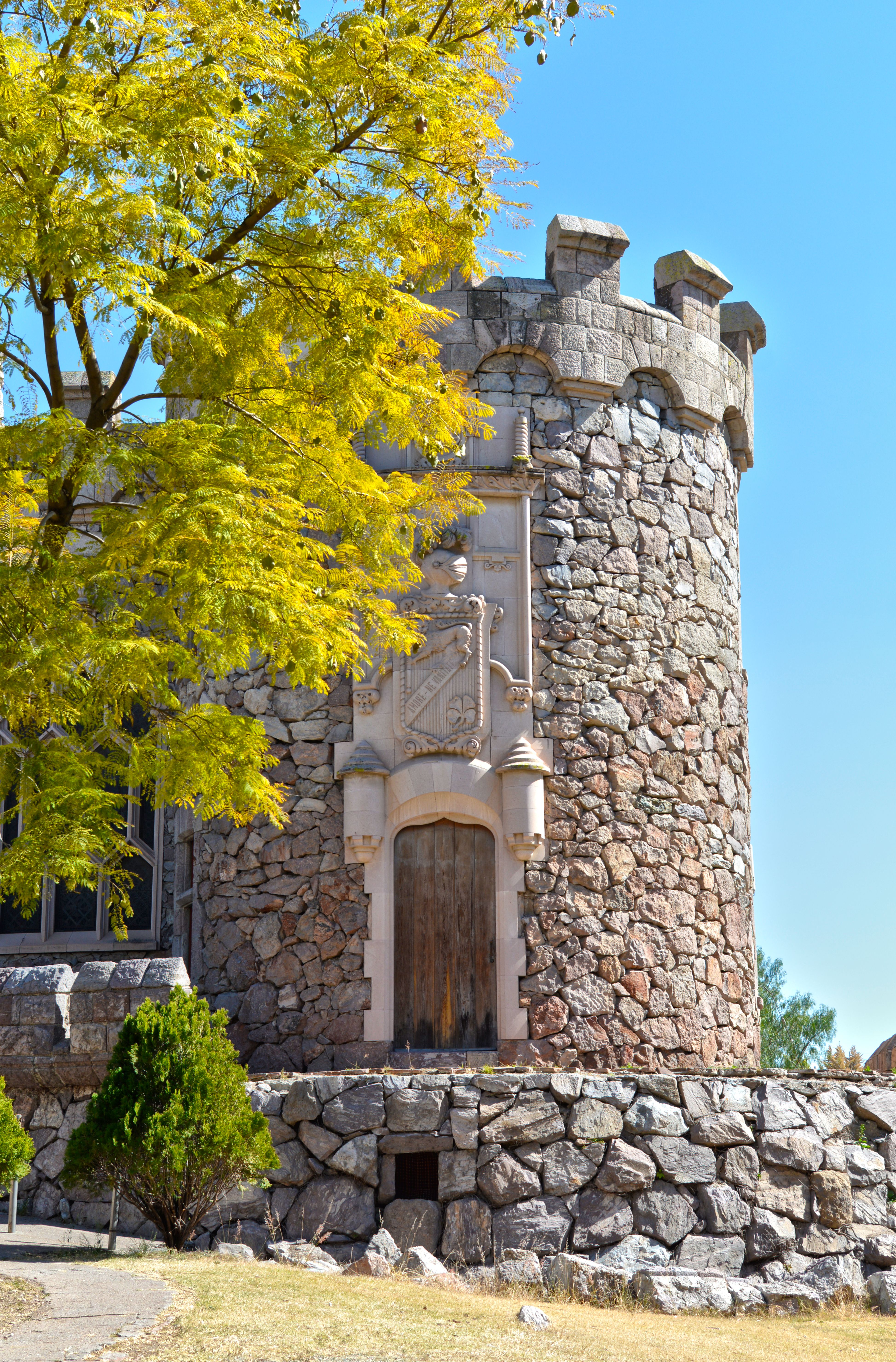 A beautiful stone tower surrounded by lush greenery in Aguascalientes, Mexico.