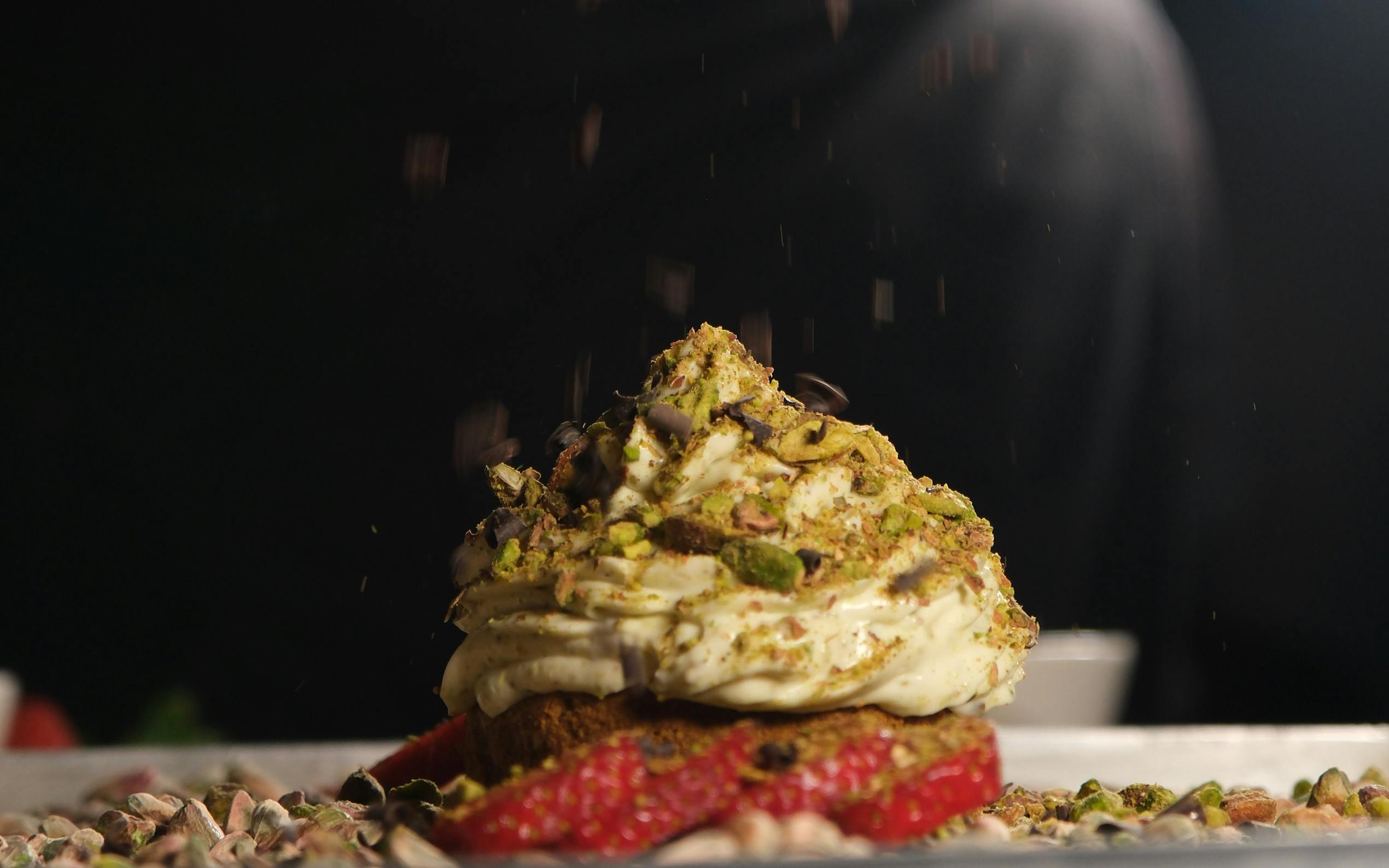 Chef preparing pistachio creme brulee