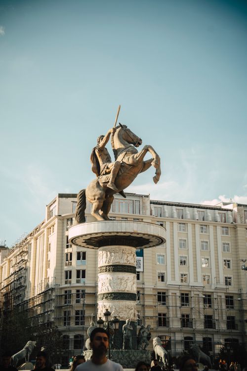 Free A dramatic view of a prominent warrior statue on horseback in Skopje, capturing its grandeur and urban setting. Stock Photo