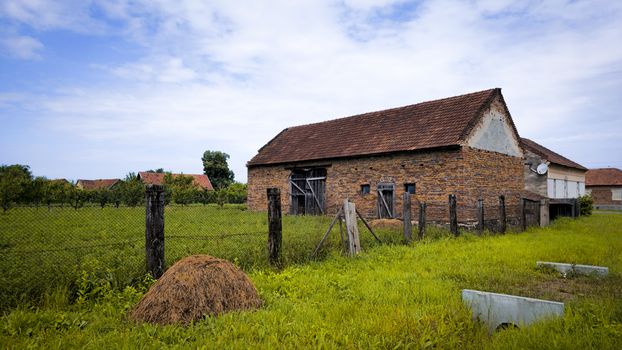 Charming rustic house in a serene Romanian countryside setting, perfect for nature lovers.