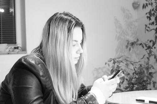 Free Young Woman Using Mobile Phone Stock Photo