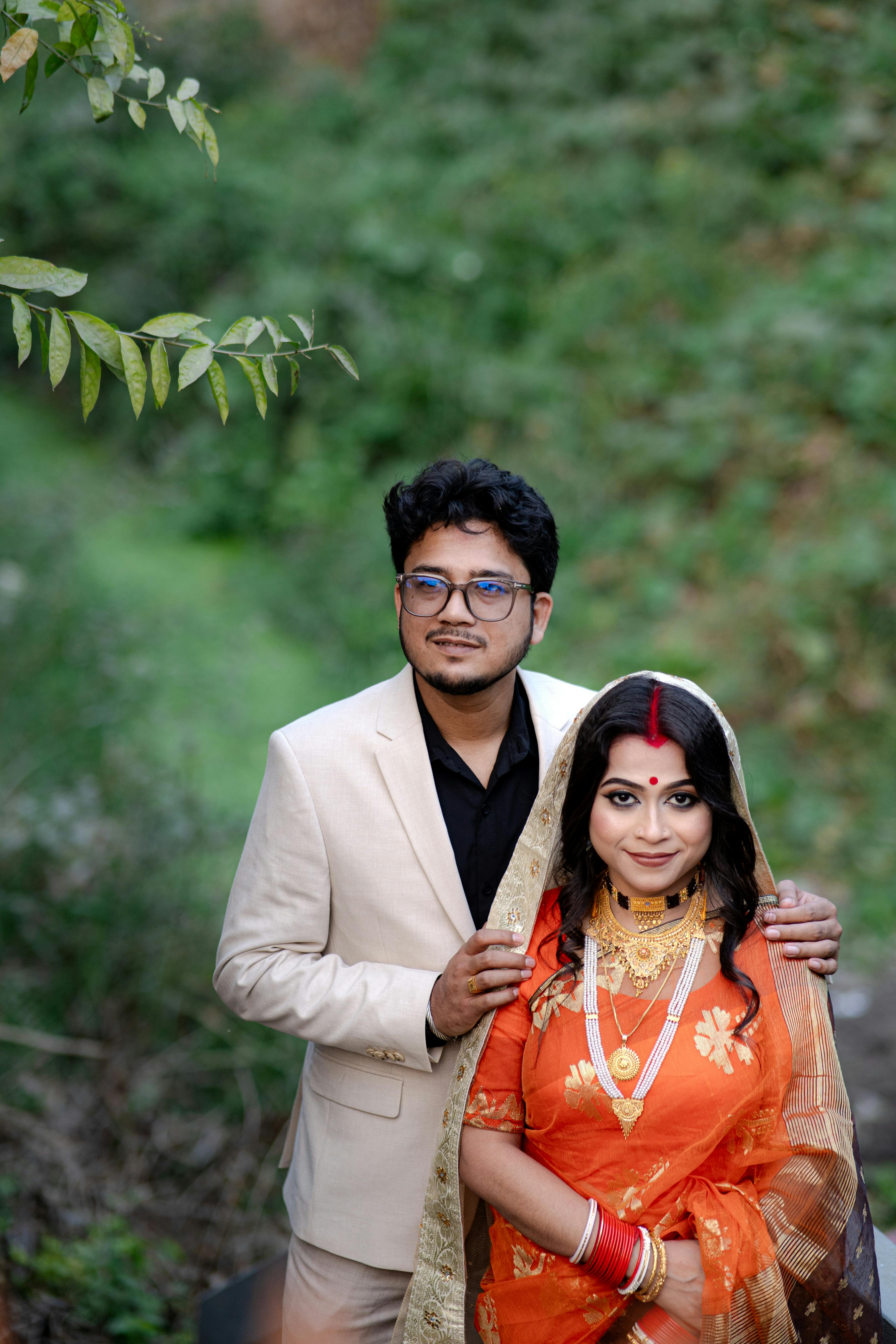 Wedding couple posing for a photo in the Eden Gardens