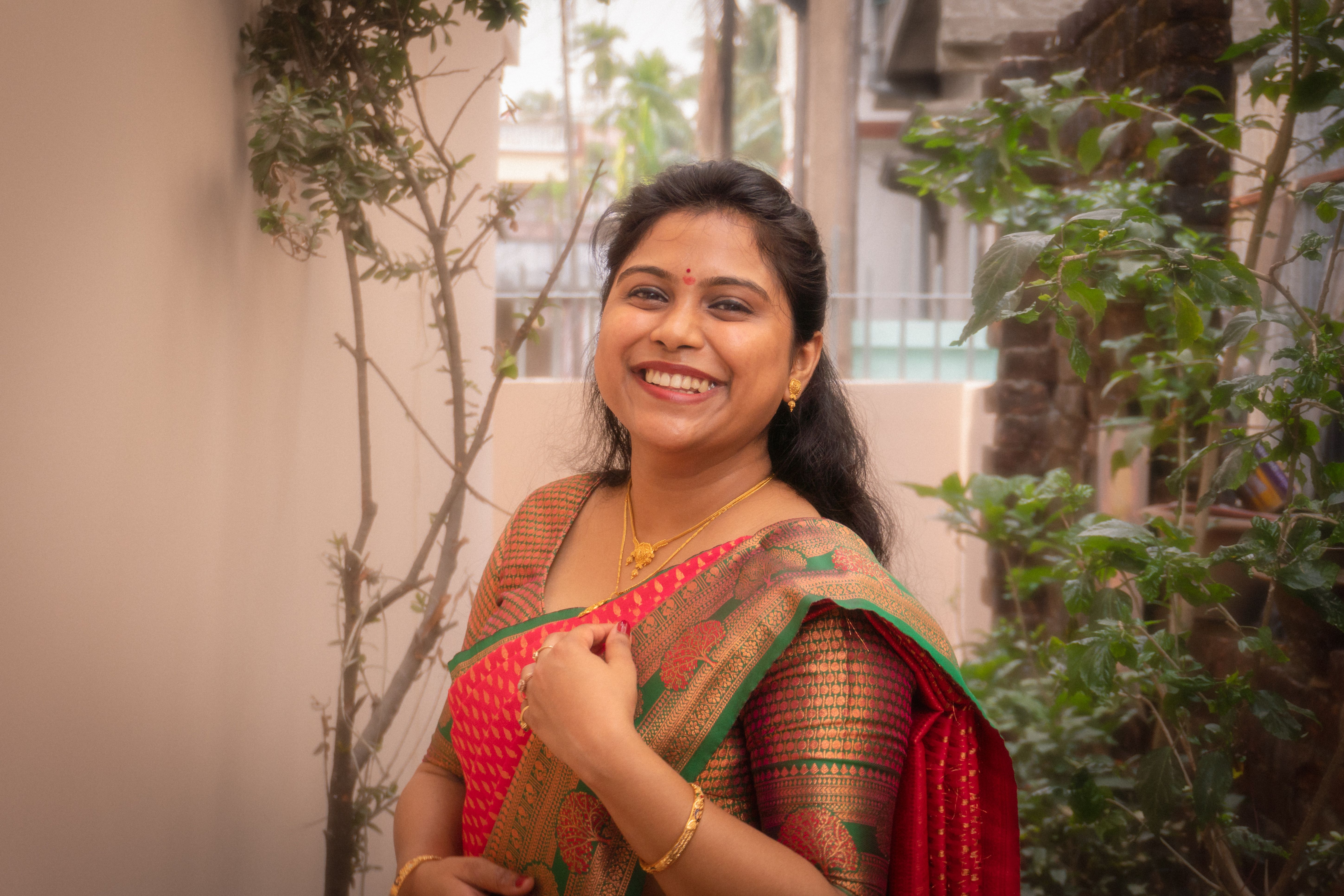 Smiling Woman in Traditional Indian Saree Outdoors · Free Stock Photo