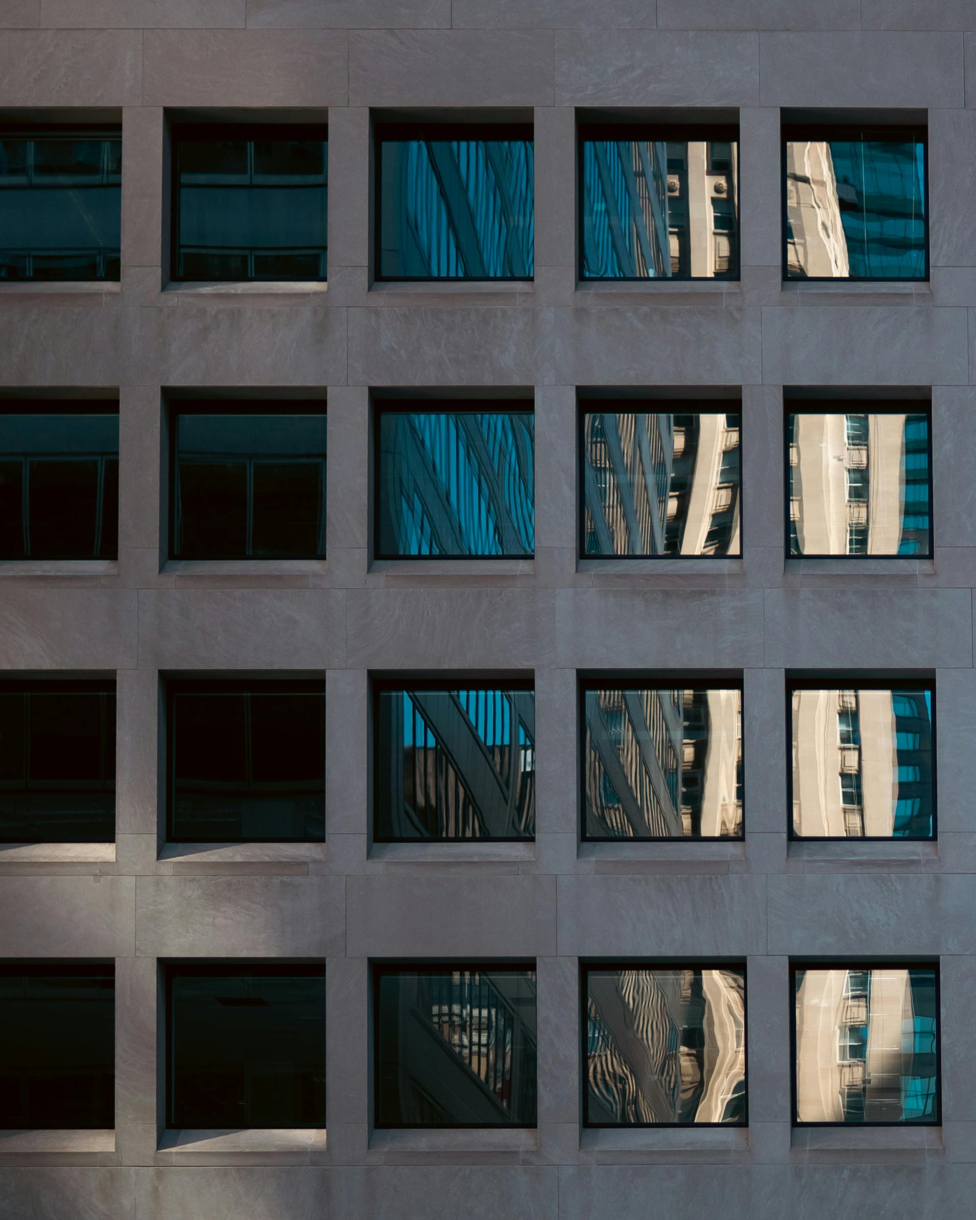 Modern architecture with reflective skyscraper windows in downtown Toronto.