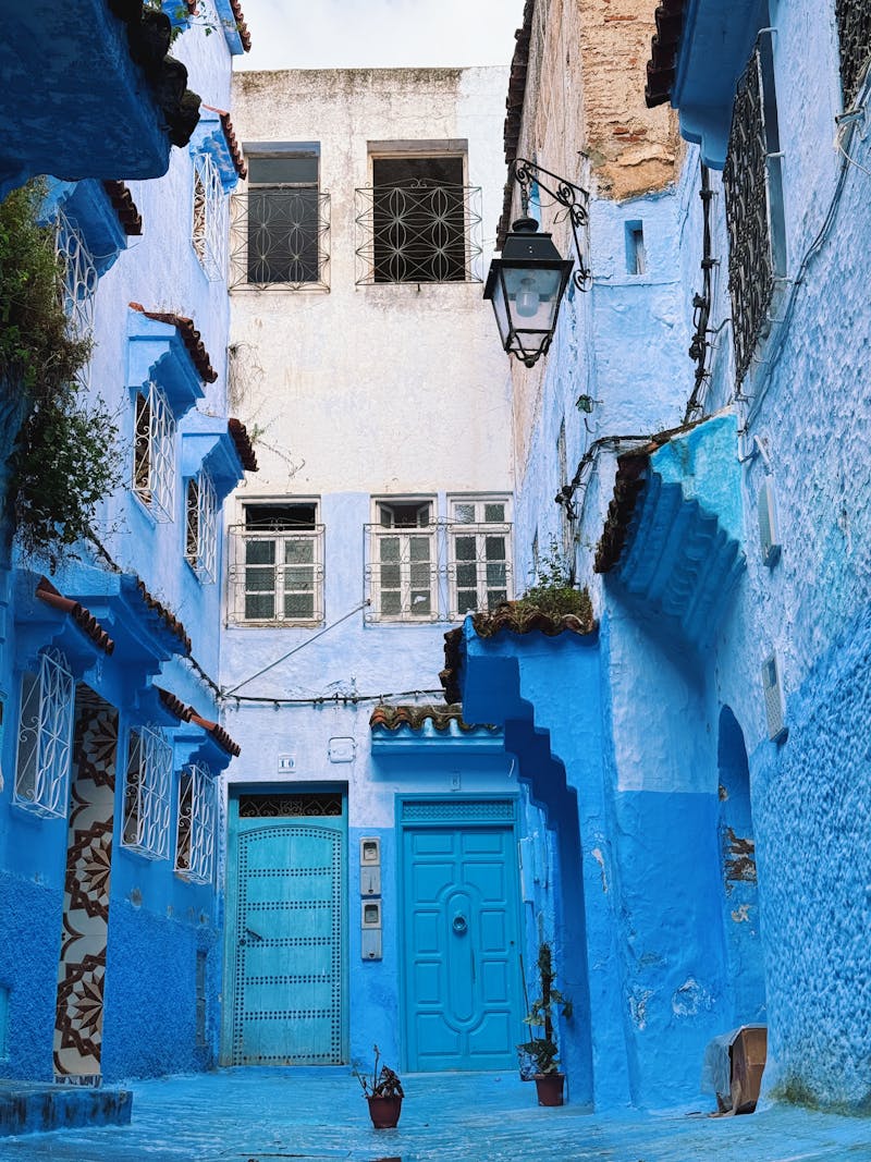 Chefchaouen blue street with steps and painted walls near Souika