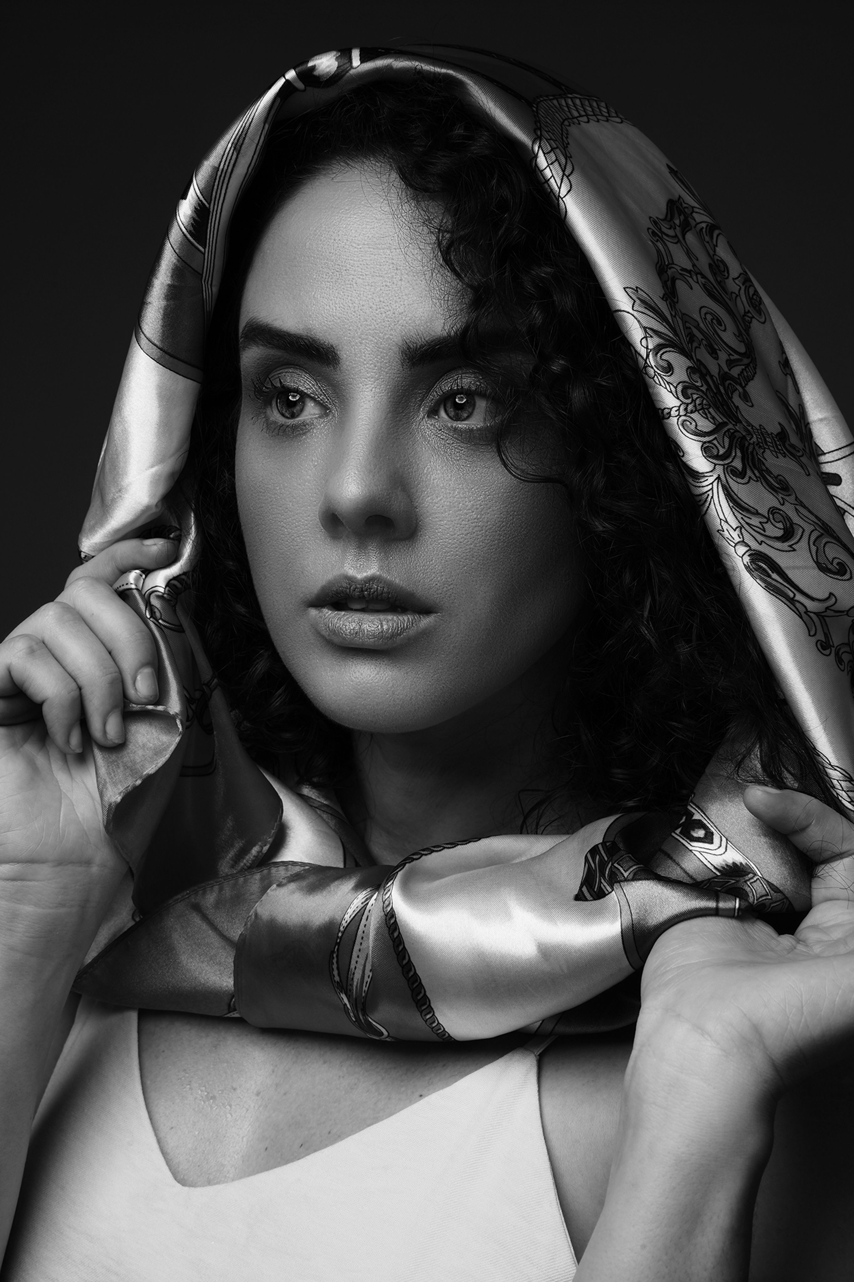 Black and white portrait with draped scarf — photo by Will Oliveira on Pexels
