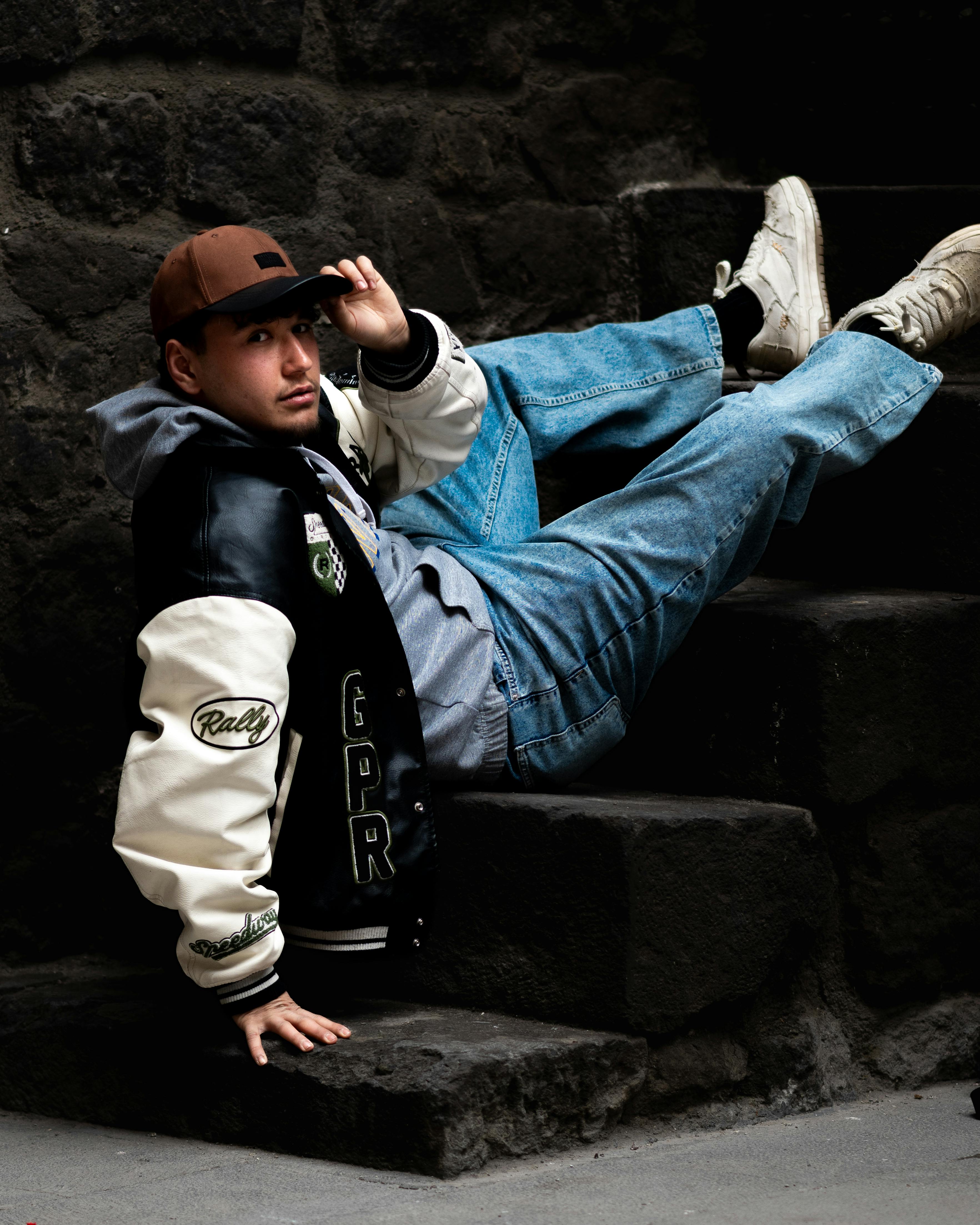 Casual portrait of a person lounging on stone steps in Kayseri, Türkiye.