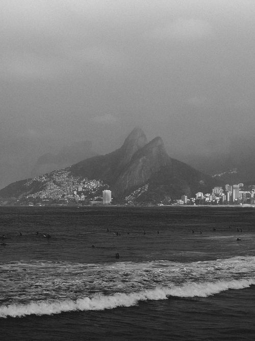 Free Monochrome image capturing the iconic Two Brothers Mountain from Ipanema beach in Rio de Janeiro, Brazil. Stock Photo