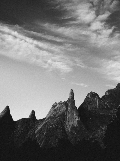 Free Striking monochrome view of jagged mountain peaks under dynamic sky. Stock Photo