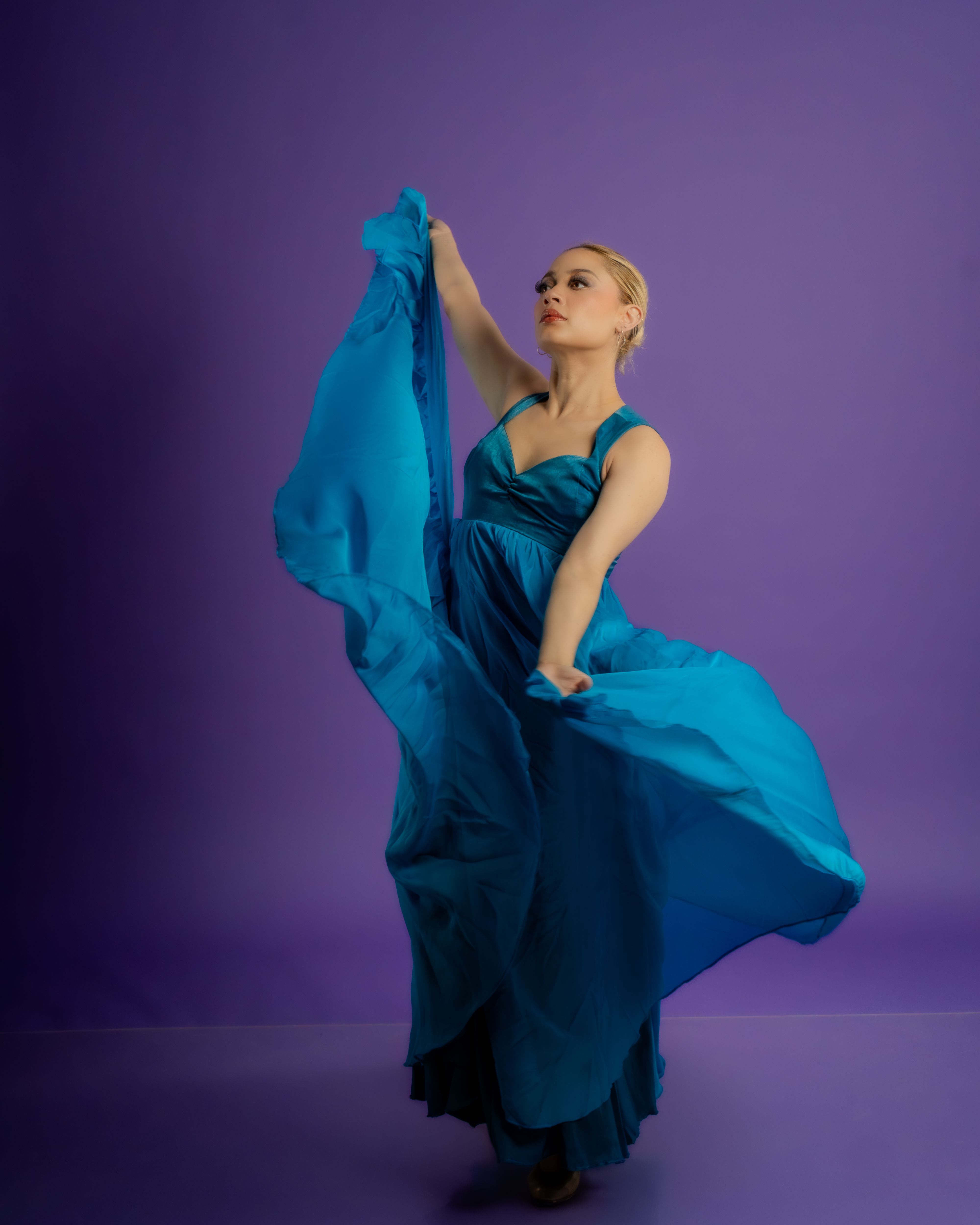 Elegant Ballerina in Flowing Blue Dress  Free Stock Photo
